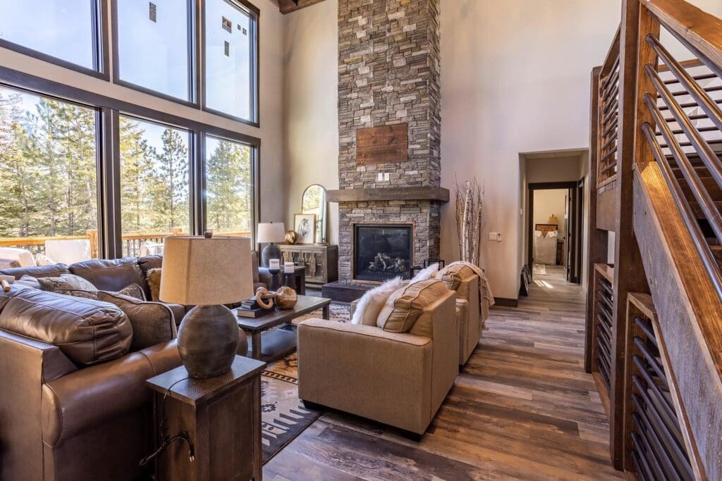 Wood accents on stone fireplace mantle in a modern living room